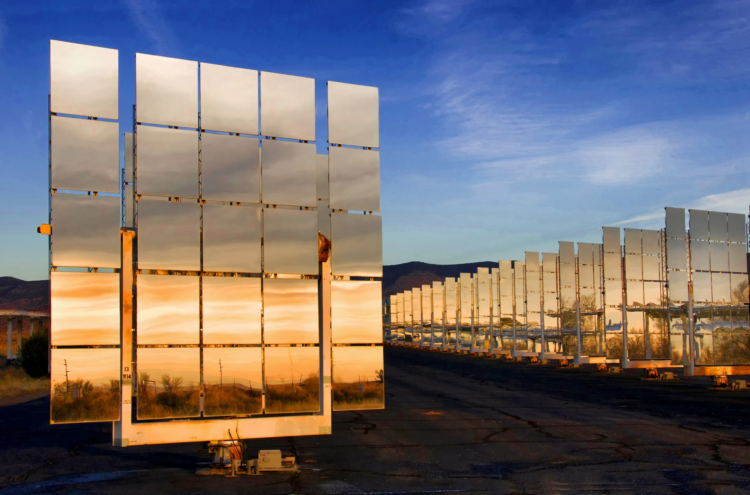 A solar mirror faces the New Mexico sunset at the National Solar Thermal Test Facility (NSTTF) at Sandia Labs. The NSTTF is the only test facility of this type in the United States.